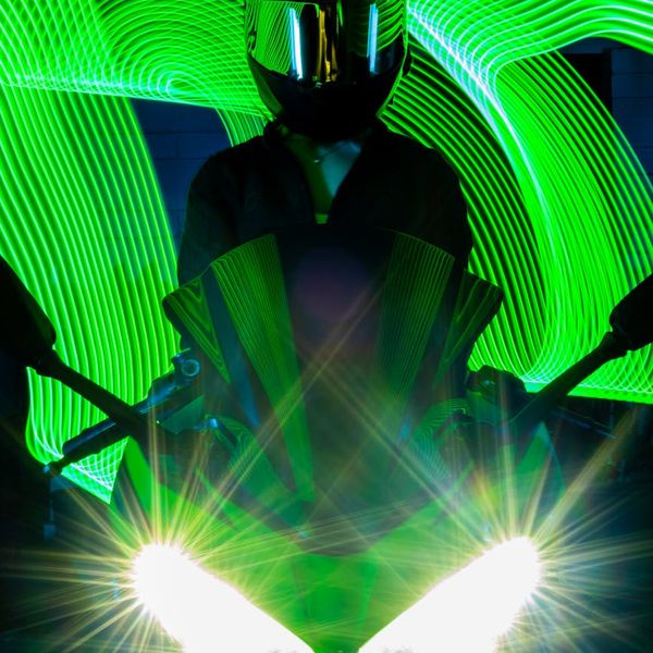 Silhouette of a man stretching against a bright, energetic background.